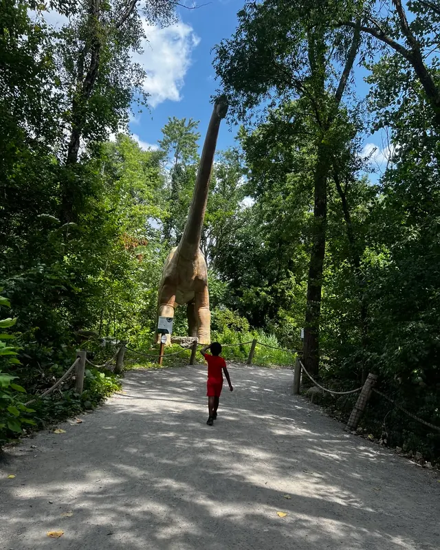 One of the littles running down a wooded trail